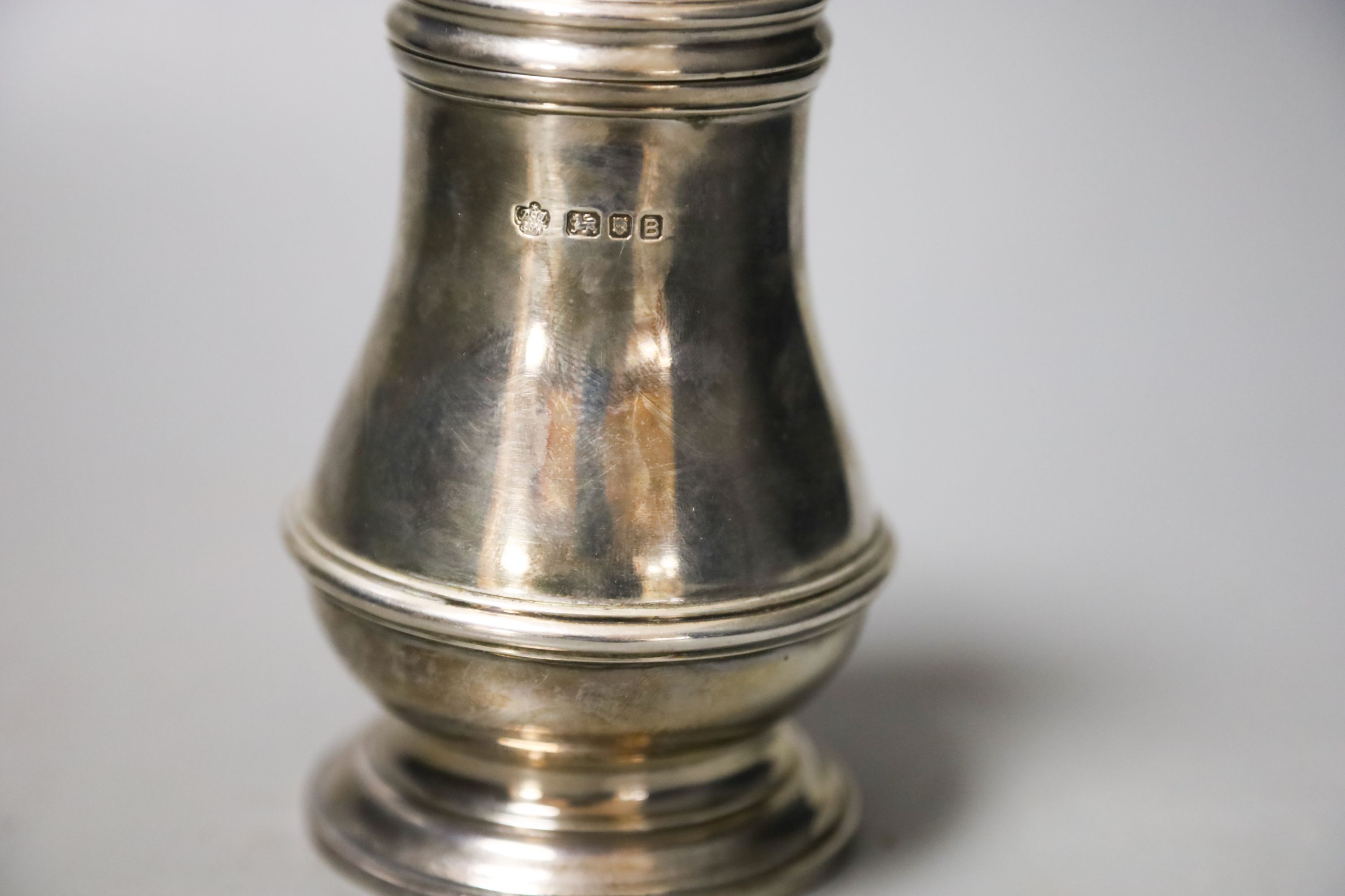 A George VI silver baluster sugar caster, London, 1937, 15.4cm, 8oz.